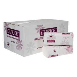 A carton of Caprice 4000CU Deluxe Slimfold Towels sits with two packs of the towels.