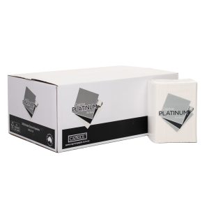 A carton of WAD1/8 Platinum Airlaid napkins sits with one packet of the napkins.